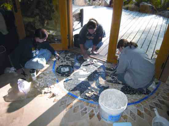 Mary’s son Andrew designed the doorway mosaic, which is created with leftover tile remnants, broken chunks of granite and onyx.